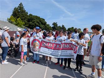 Students hold a Miles P Richmond banner