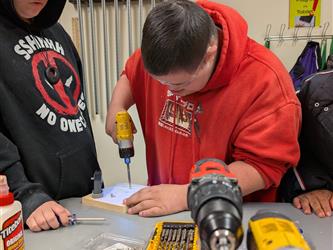 student using drill
