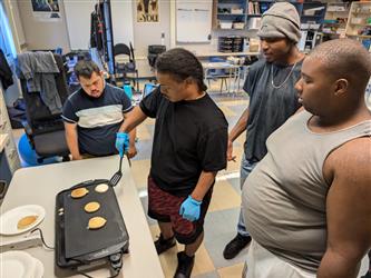student making quesadillas