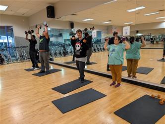 students doing matwork at the gym