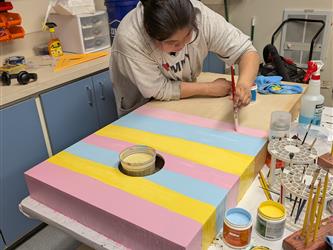 student spraypainting