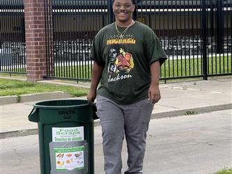 student taking out trash